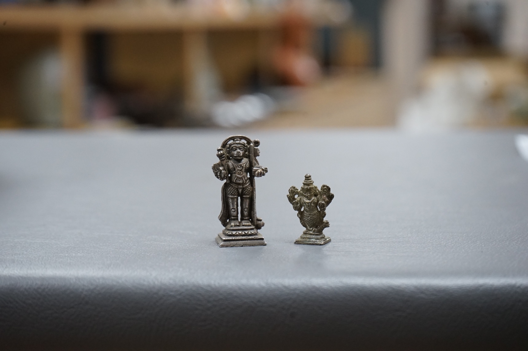 Two small Hindu statuettes, Hanuman (monkey), possibly silver, and Matsya (figure with fish tail), possibly late 19th/early 20th century, largest 3.5cm high